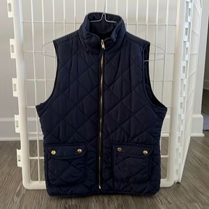 Quinn navy blue quilted vest with gold accents